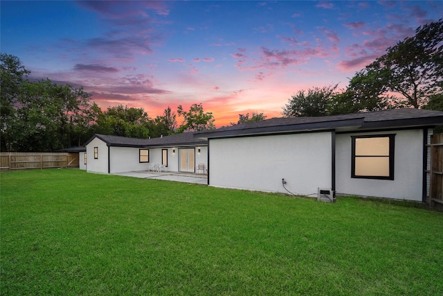 701 W 39th St, Houston, TX 77018 - back of property at dusk featuring a patio area