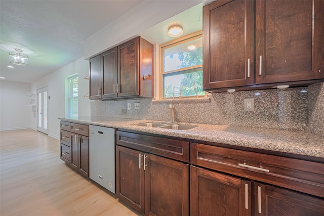 12206 Ashcroft Dr, Houston, TX 77035 - kitchen with a sink, dishwashing machine, light wood-type flooring, tasteful backsplash, and dark brown cabinetry