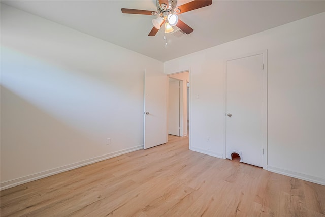 12206 Ashcroft Dr, Houston, TX 77035 - unfurnished bedroom with light wood-type flooring, baseboards, and a ceiling fan