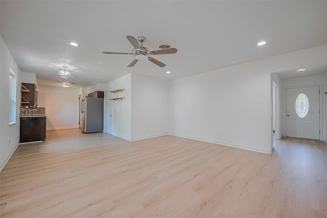 12206 Ashcroft Dr, Houston, TX 77035 - unfurnished living room with light wood-type flooring, recessed lighting, a ceiling fan, and baseboards