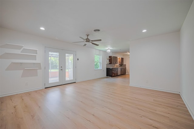 12206 Ashcroft Dr, Houston, TX 77035 - unfurnished living room with light wood finished floors, french doors, baseboards, and recessed lighting