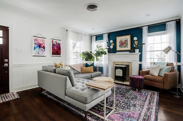 1144 Dorothy St, Houston, TX 77008 - living area featuring a fireplace with flush hearth, wood finished floors, healthy amount of natural light, and baseboards