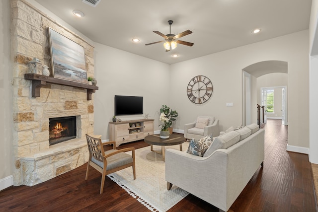 4215 Orchard Arbor Ln, Sugar Land, TX 77479 - living area featuring arched walkways, a stone fireplace, a ceiling fan, wood finished floors, and recessed lighting