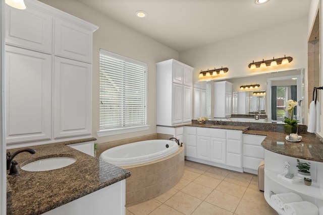 4215 Orchard Arbor Ln, Sugar Land, TX 77479 - full bathroom with two vanities, a bath, tile patterned flooring, and recessed lighting