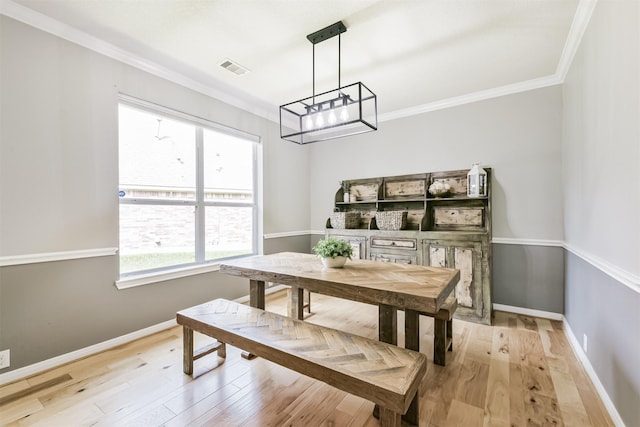 16802 Cherokee Lake Ln, Houston, TX 77044 - dining area featuring crown molding, light wood-style floors, and baseboards