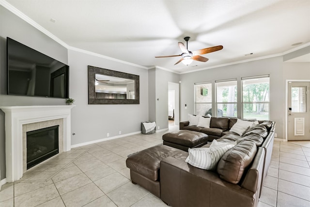 16802 Cherokee Lake Ln, Houston, TX 77044 - living room with light tile patterned floors, a ceiling fan, ornamental molding, baseboards, and a fireplace