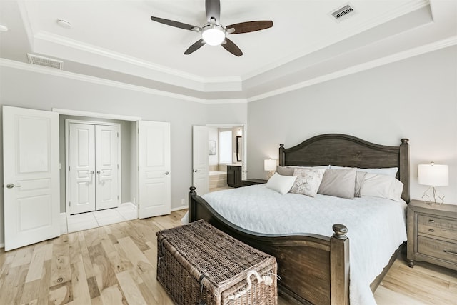 16802 Cherokee Lake Ln, Houston, TX 77044 - bedroom with a raised ceiling, light wood-type flooring, ornamental molding, ceiling fan, and baseboards