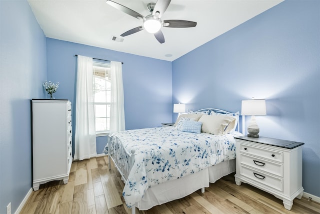 16802 Cherokee Lake Ln, Houston, TX 77044 - bedroom featuring light wood-style floors, baseboards, and a ceiling fan