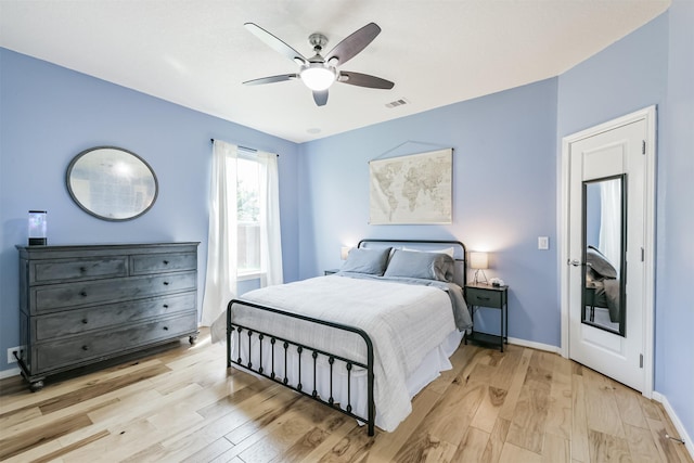 16802 Cherokee Lake Ln, Houston, TX 77044 - bedroom with light wood-type flooring, ceiling fan, and baseboards