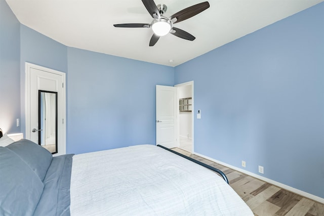 16802 Cherokee Lake Ln, Houston, TX 77044 - bedroom featuring light wood-style floors, baseboards, and ceiling fan