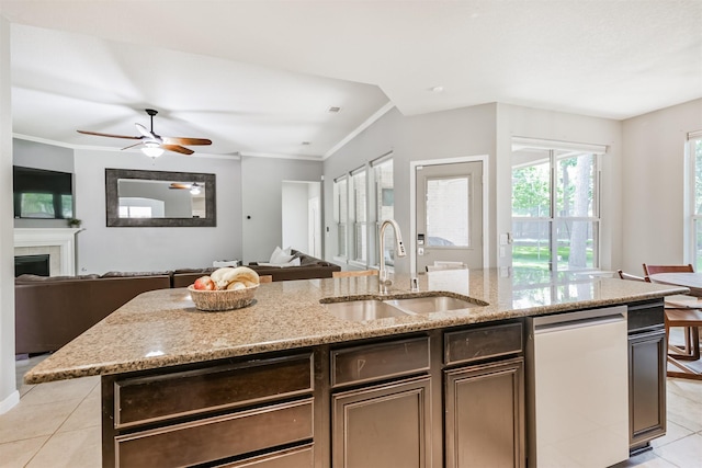 16802 Cherokee Lake Ln, Houston, TX 77044 - kitchen with open floor plan, light tile patterned floors, a sink, dishwasher, and crown molding