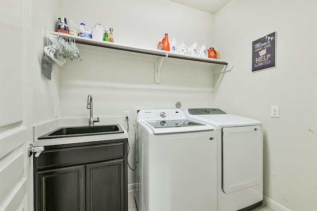 16802 Cherokee Lake Ln, Houston, TX 77044 - laundry room with separate washer and dryer, cabinet space, and baseboards