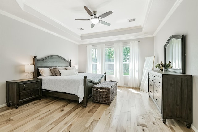 16802 Cherokee Lake Ln, Houston, TX 77044 - bedroom with a raised ceiling, light wood finished floors, crown molding, and ceiling fan