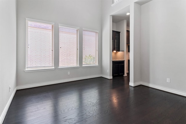 4926 Thunder Creek Ln, Sugar Land, TX 77479 - unfurnished room with dark wood-style flooring and baseboards