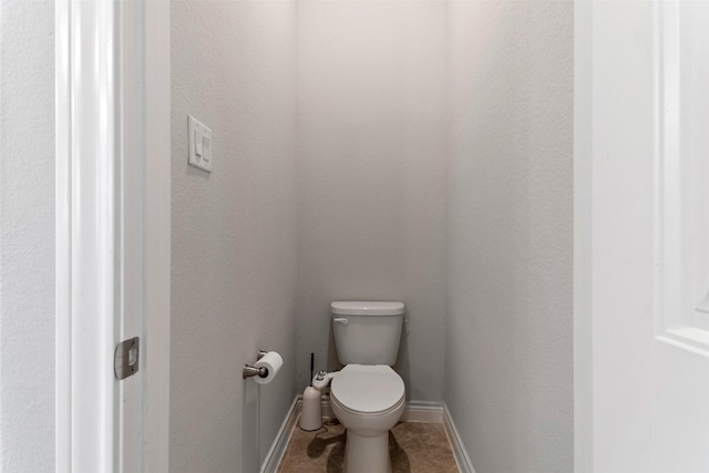 4926 Thunder Creek Ln, Sugar Land, TX 77479 - bathroom with toilet, baseboards, and tile patterned floors