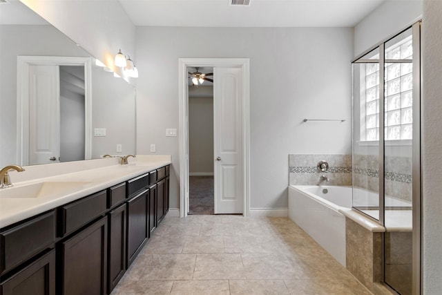 4926 Thunder Creek Ln, Sugar Land, TX 77479 - full bath with double vanity, a bath, ceiling fan, baseboards, and tile patterned flooring