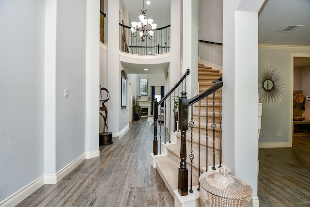 29016 Concan Crossing Ct, Katy, TX 77494 - entryway with a chandelier, baseboards, wood finished floors, and crown molding