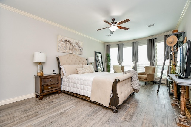 29016 Concan Crossing Ct, Katy, TX 77494 - bedroom featuring light wood-style floors, crown molding, baseboards, and a ceiling fan