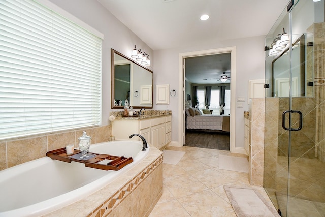 29016 Concan Crossing Ct, Katy, TX 77494 - ensuite bathroom with a garden tub, a shower stall, vanity, tile patterned floors, and ceiling fan