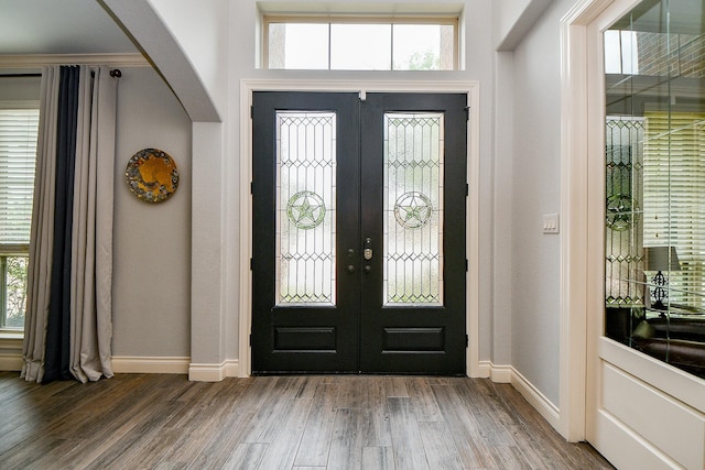 29016 Concan Crossing Ct, Katy, TX 77494 - entryway with french doors, wood finished floors, arched walkways, and baseboards