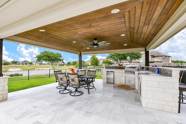 29016 Concan Crossing Ct, Katy, TX 77494 - view of patio featuring outdoor dining space, a water view, and ceiling fan