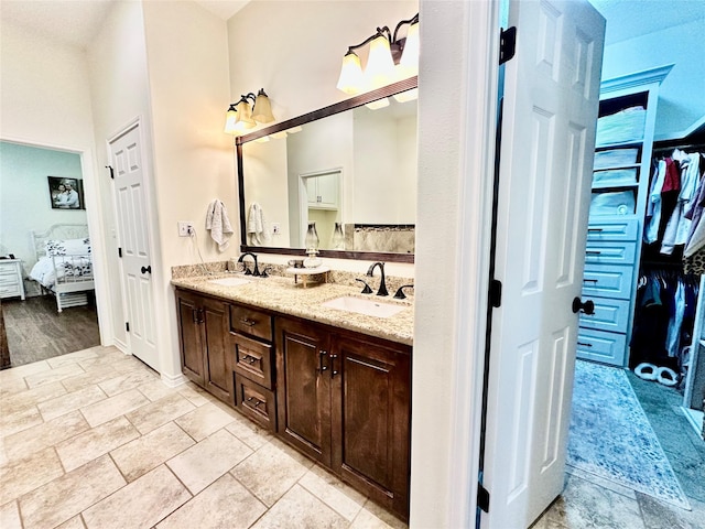 4815 Fm 2827th Rd, Warren, TX 77664 - bathroom featuring ensuite bathroom, double vanity, and a spacious closet