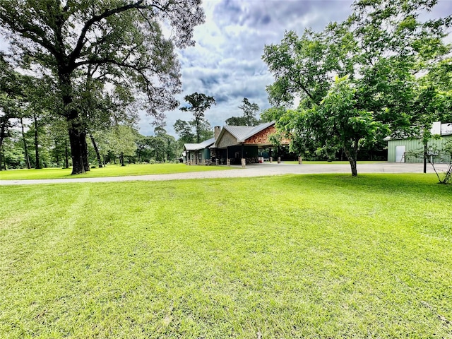 4815 Fm 2827th Rd, Warren, TX 77664 - view of green lawn with curved driveway