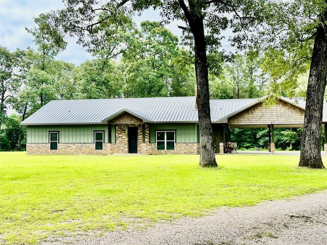 4815 Fm 2827th Rd, Warren, TX 77664 - view of front of property with board and batten siding, stone siding, and a front lawn