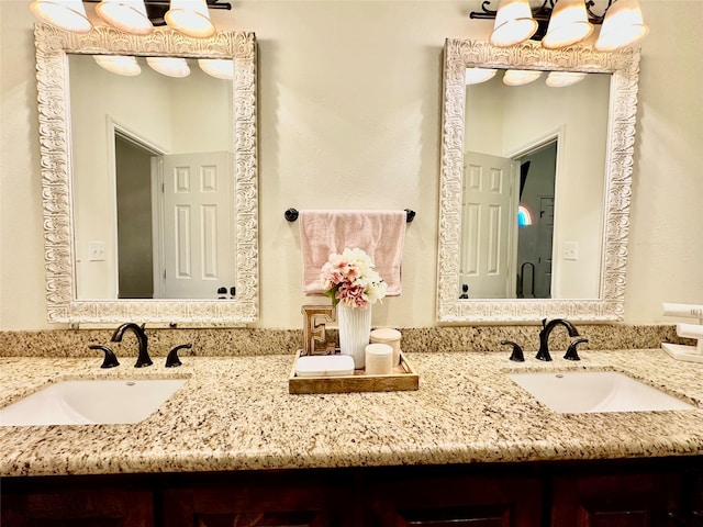 4815 Fm 2827th Rd, Warren, TX 77664 - bathroom featuring double vanity and a chandelier