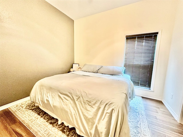 4815 Fm 2827th Rd, Warren, TX 77664 - bedroom with baseboards and wood finished floors