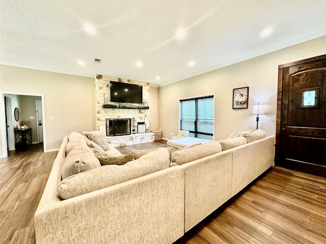 4815 Fm 2827th Rd, Warren, TX 77664 - living room with wood finished floors, a fireplace, crown molding, recessed lighting, and baseboards