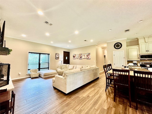 4815 Fm 2827th Rd, Warren, TX 77664 - living area featuring wood finished floors, ornamental molding, recessed lighting, and baseboards