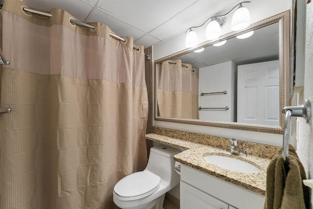 6102 Seawall Blvd Unit 271, Galveston, TX 77551 - bathroom featuring vanity, toilet, a drop ceiling, and a shower with curtain