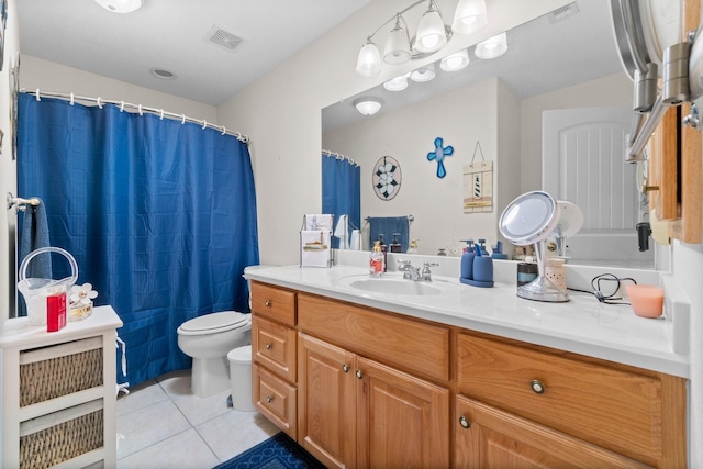 197 Westwood Dr E, Trinity, TX 75862 - bathroom featuring toilet, tile patterned flooring, and vanity
