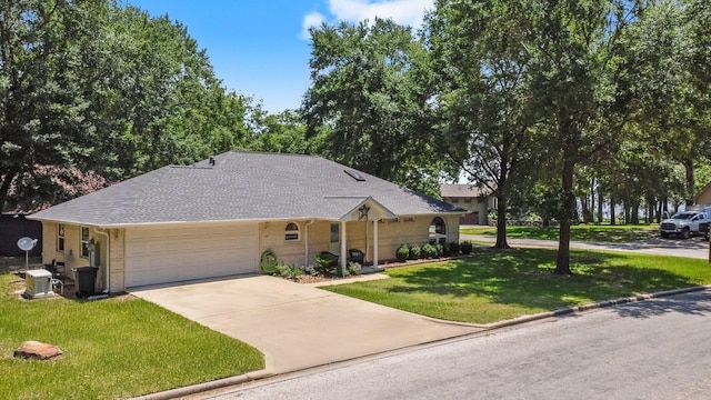 197 Westwood Dr E, Trinity, TX 75862 - ranch-style house with a front yard, a garage, concrete driveway, roof with shingles, and brick siding