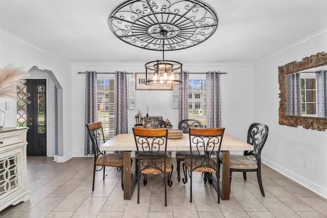 1406 Grand Valley Dr, Houston, TX 77090 - dining space featuring plenty of natural light, baseboards, crown molding, light tile patterned floors, and arched walkways