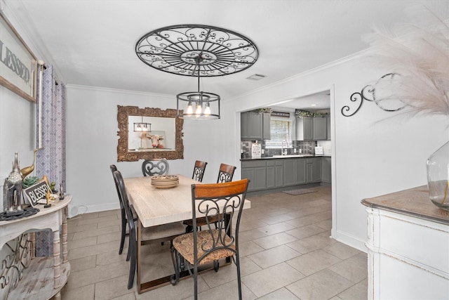 1406 Grand Valley Dr, Houston, TX 77090 - dining space featuring ornamental molding, a chandelier, light tile patterned flooring, and baseboards
