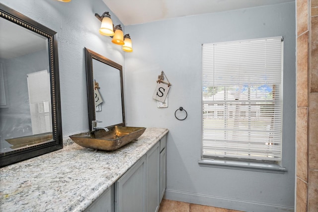 1406 Grand Valley Dr, Houston, TX 77090 - bathroom with vanity, baseboards, and tile patterned flooring