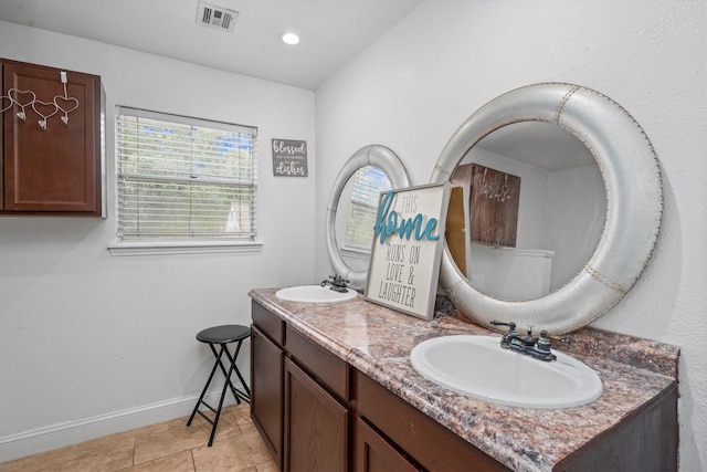 1406 Grand Valley Dr, Houston, TX 77090 - bathroom featuring double vanity, baseboards, recessed lighting, and tile patterned floors