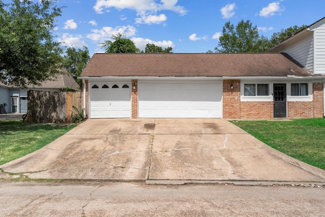 1406 Grand Valley Dr, Houston, TX 77090 - view of front of house with brick siding, concrete driveway, roof with shingles, and a garage