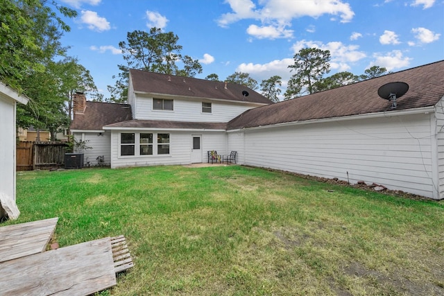 1406 Grand Valley Dr, Houston, TX 77090 - back of property featuring central AC and a patio area