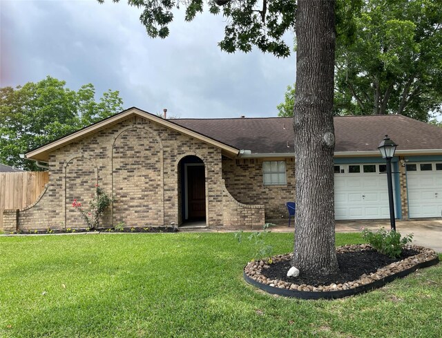 15530 Edenvale St, Friendswood, TX 77546 - view of front of house with an attached garage, brick siding, concrete driveway, and a shingled roof