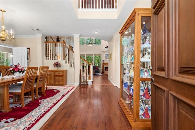 7419 Lorna Rd, Montgomery, TX 77316 - entrance foyer with stairway, hardwood / wood-style floors, a chandelier, baseboards, and decorative columns