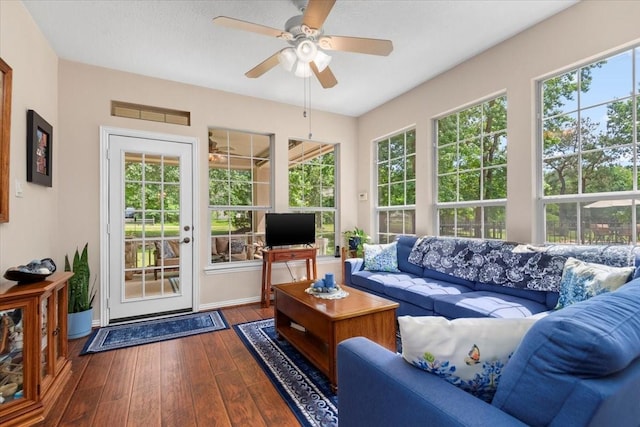 7419 Lorna Rd, Montgomery, TX 77316 - living area featuring ceiling fan, dark wood-style floors, and baseboards