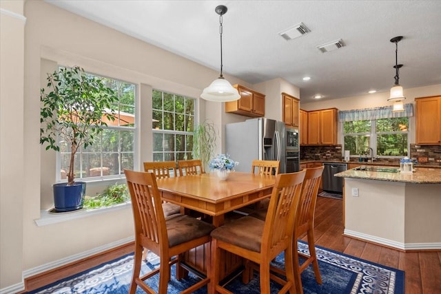 7419 Lorna Rd, Montgomery, TX 77316 - dining area featuring dark wood-style flooring, baseboards, and recessed lighting