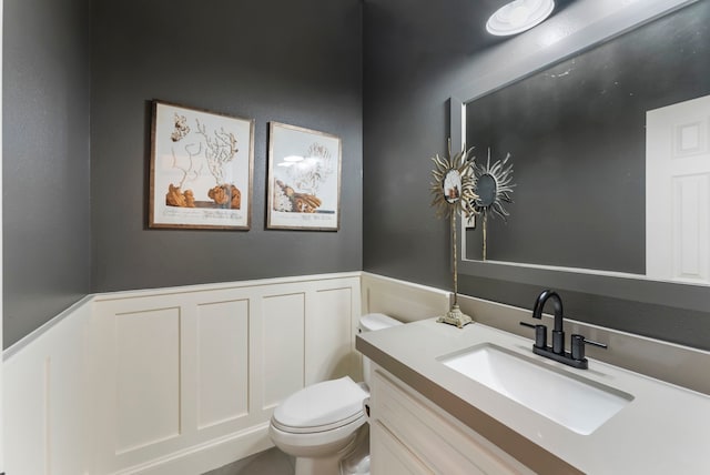 3714 Falun Ct, Spring, TX 77386 - bathroom featuring wainscoting, a decorative wall, toilet, and vanity