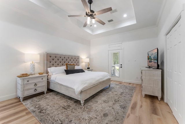 3714 Falun Ct, Spring, TX 77386 - bedroom with a raised ceiling, access to outside, light wood finished floors, baseboards, and ornamental molding