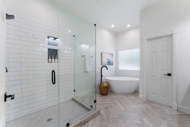 3714 Falun Ct, Spring, TX 77386 - bathroom with a shower stall, a freestanding tub, baseboards, and recessed lighting