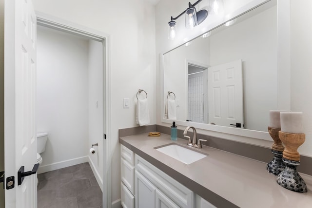 3714 Falun Ct, Spring, TX 77386 - bathroom featuring toilet, vanity, tile patterned floors, and baseboards