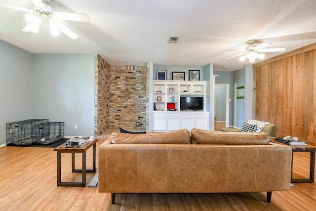 22035 Buescher Rd, Tomball, TX 77377 - living room with a ceiling fan, wood finished floors, and baseboards